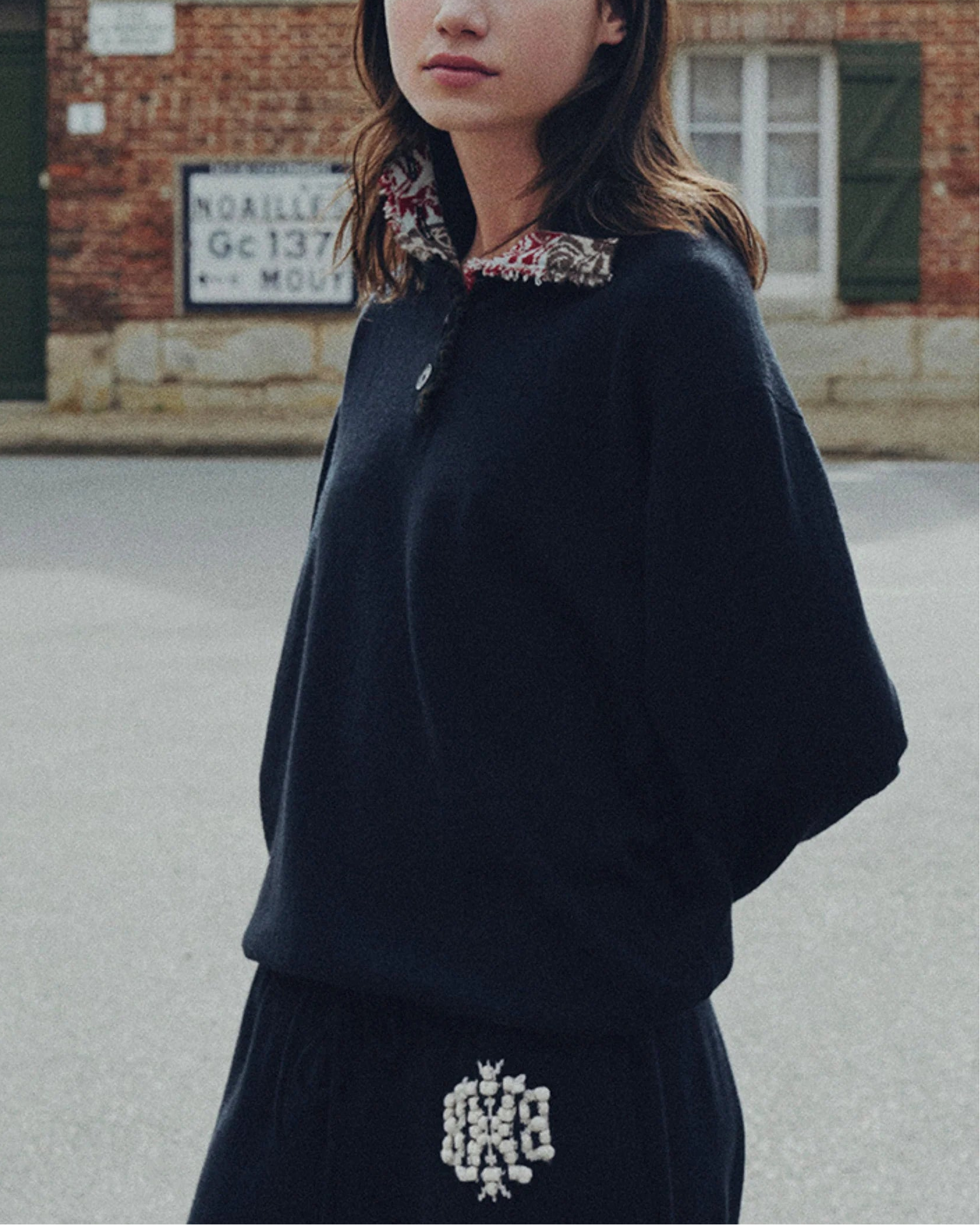 Oversized cashmere sweater with polo shirt collar and ribbon detail